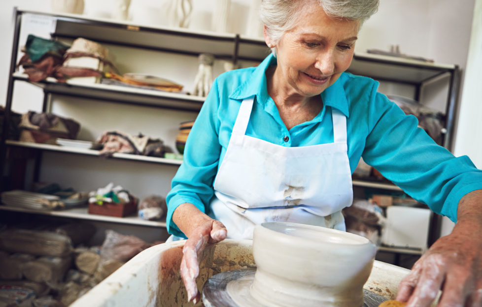 Shot of a senior woman making a ceramic pot in a workshop