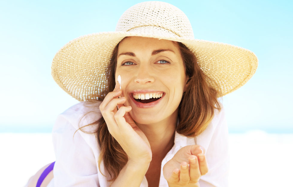 Lady at beach enjoying sunshine