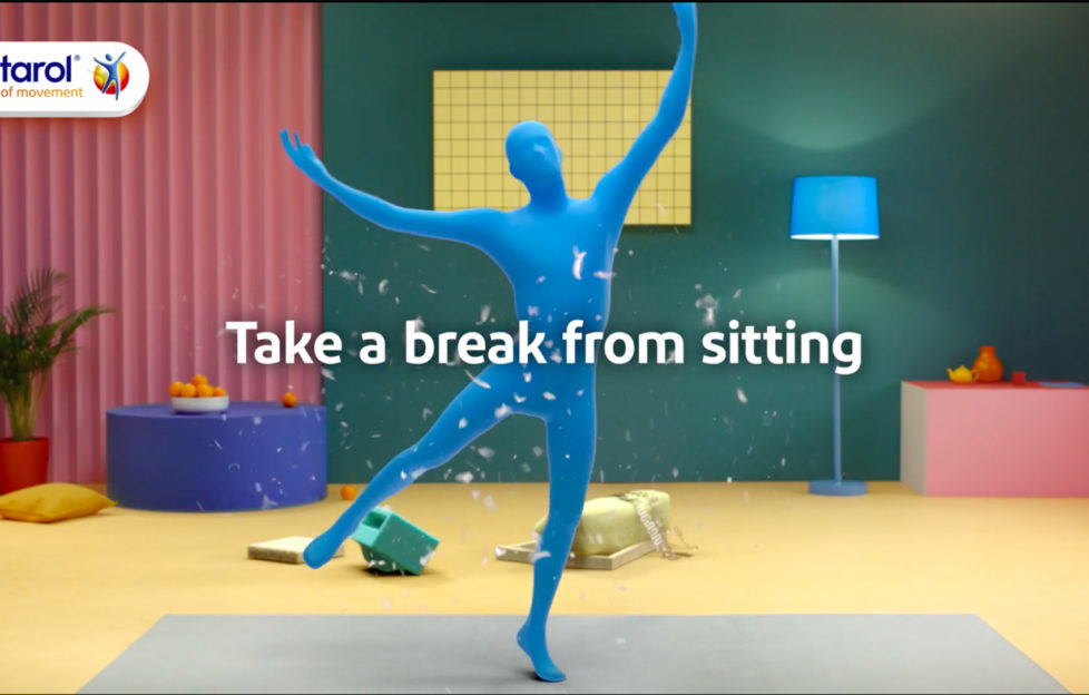 Figure in blue body suit dancing