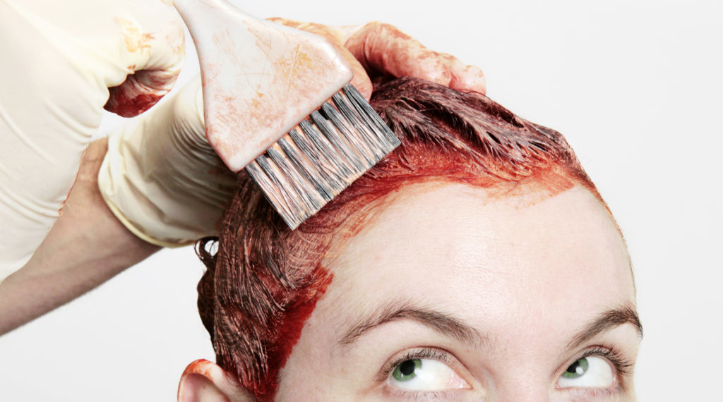 woman having hair coloured