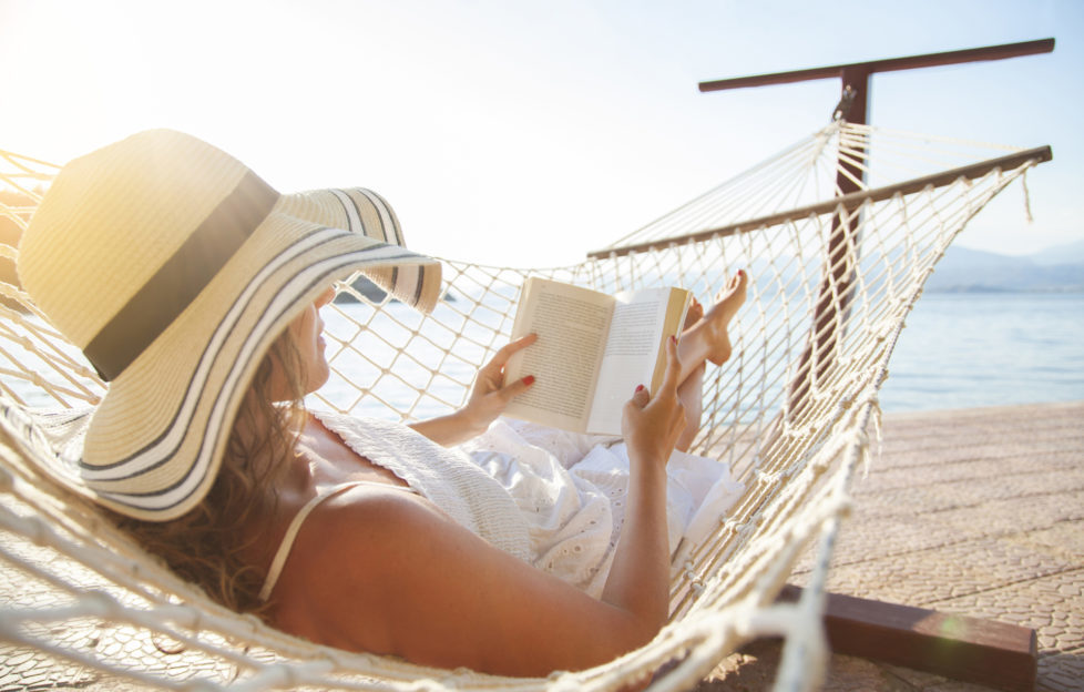 Woman in a hammock with book on summer day Pic: Istockphoto