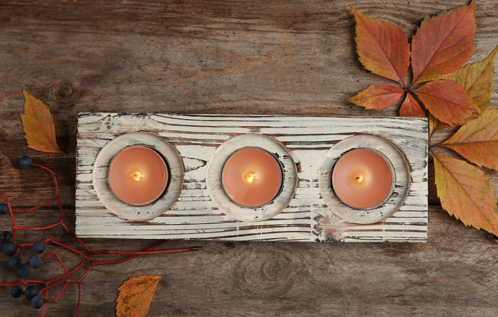 Candles and autumn leaves