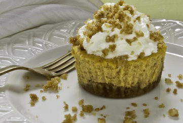 Pumpkin and California walnut cupcakes and fork on a plate surrounded by crumbs