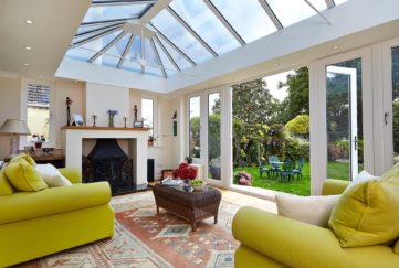 Yellow sofas in conservatory
