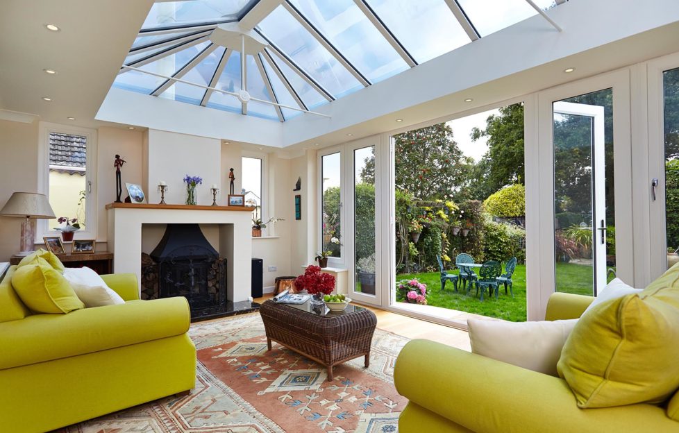 Yellow sofas in conservatory