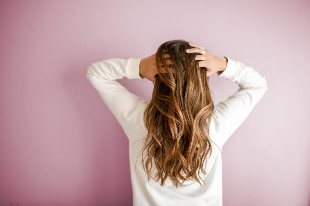 Woman running hands through hair