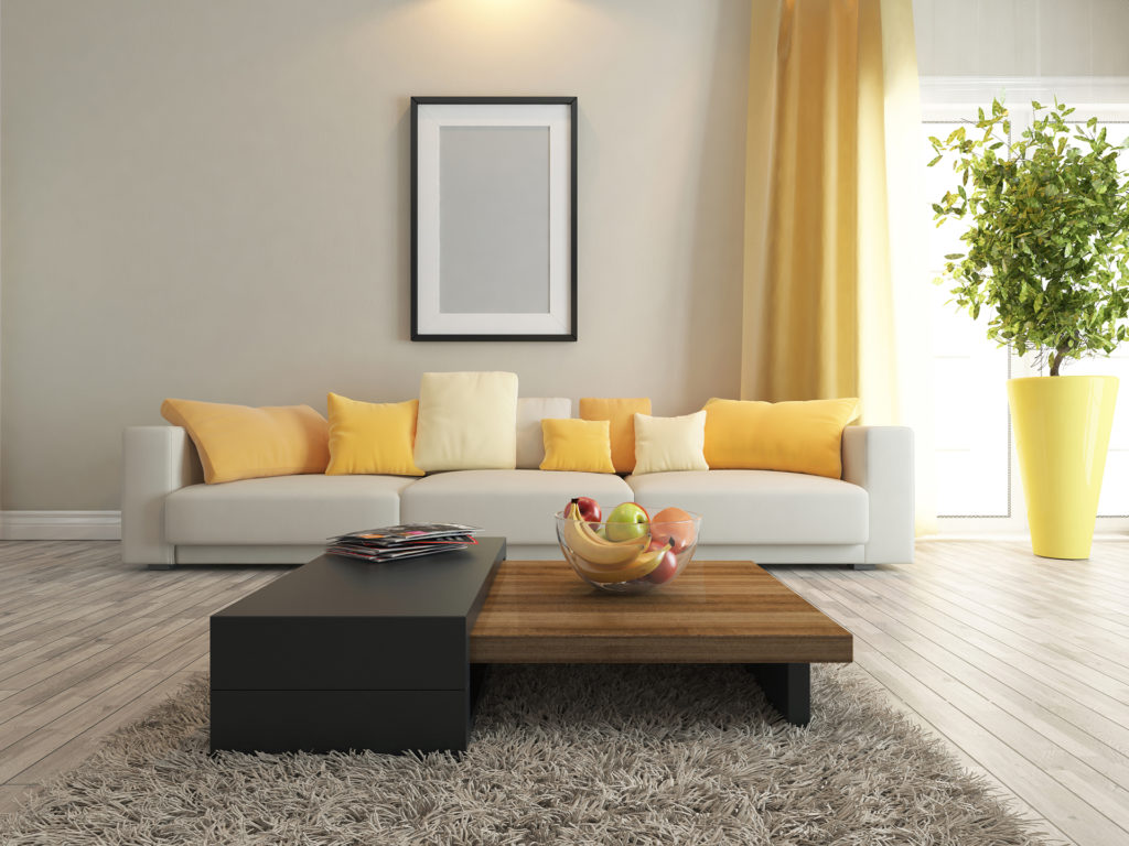 modern interior design living room with yellow curtains, cushions and oversized plant pot Pic: Istockphoto