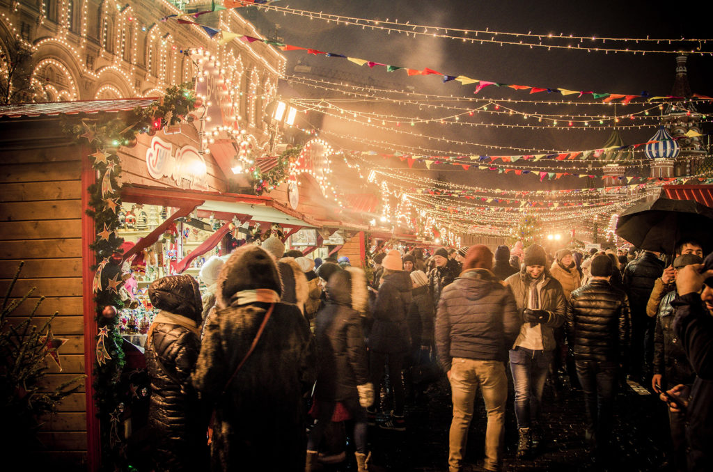 People at a night-time Christmas market