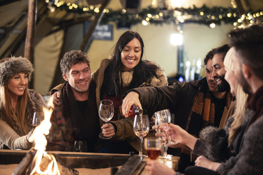 A group of friends drinking wine at Christmas Pic: Istockphoto