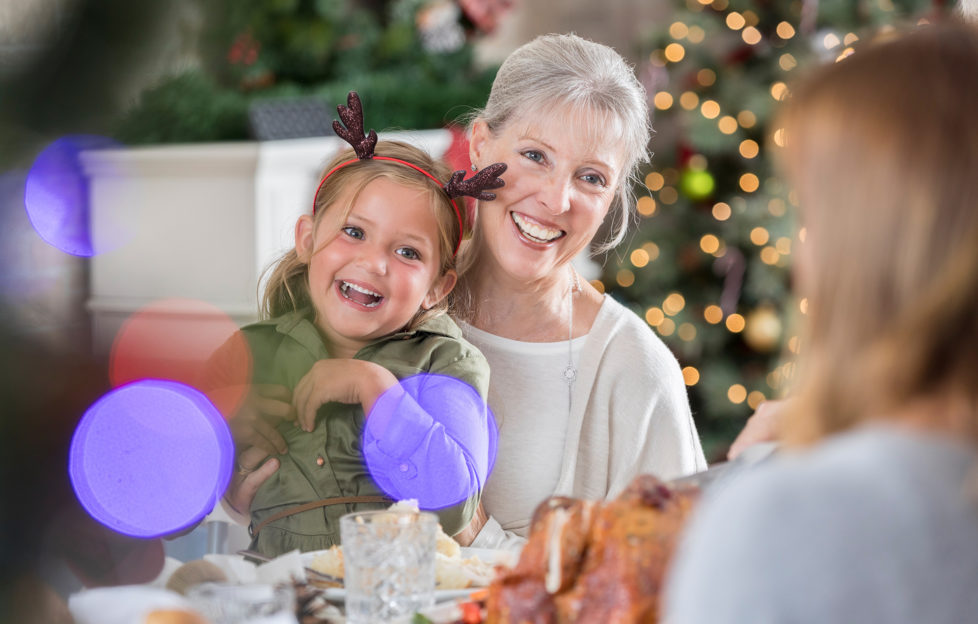 Three generations of women enjoy Christmas dinner