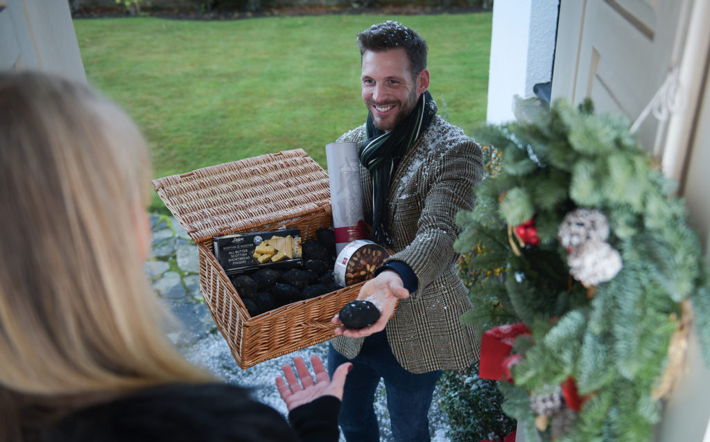 Gavin McDonald from Oban brings the gift of coal to the door practises in a bid by Lidl to bring back the Scottish tradition of first-footing.