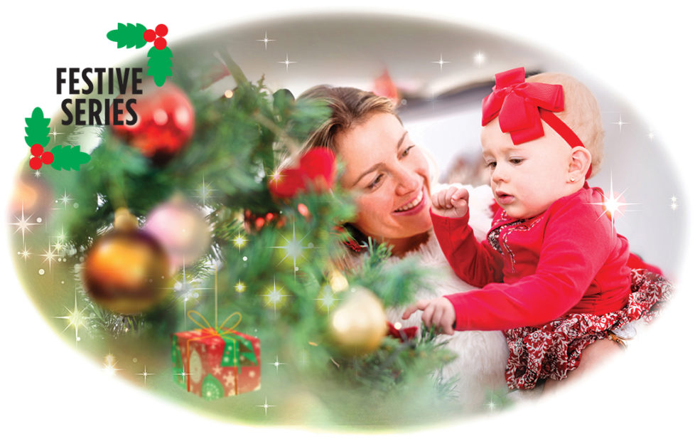 Lady with baby at Christmas Tree Illustration: Istockphoto, Mandy Dixon