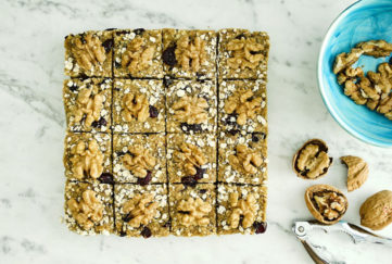 Block of raw flapjack, cut into 16, topped with walnuts