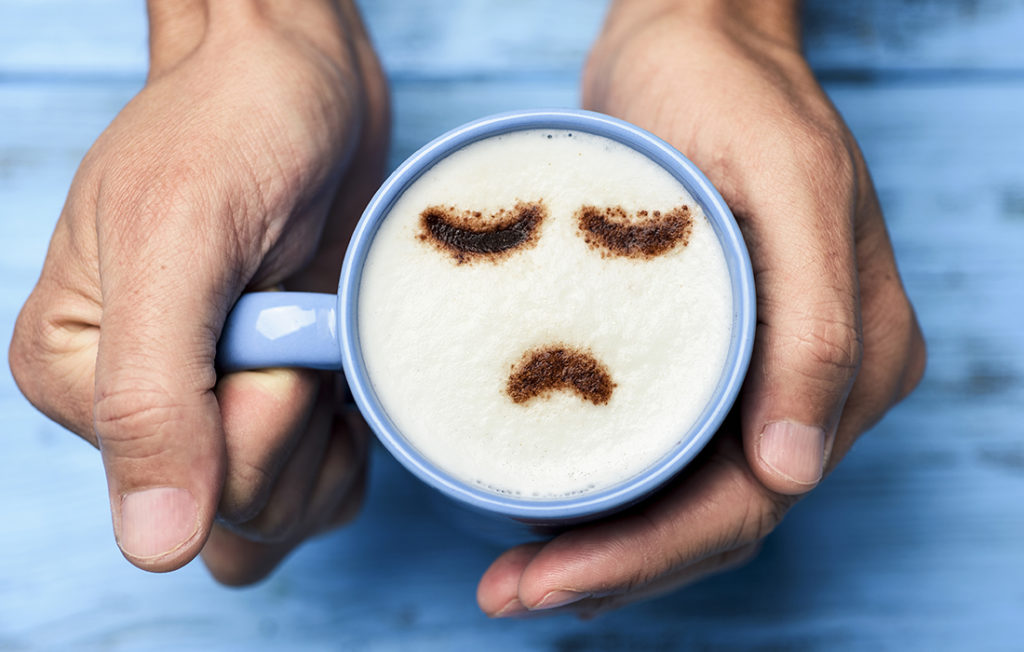Coffee with a sad face image in froth Pic: Istockphoto