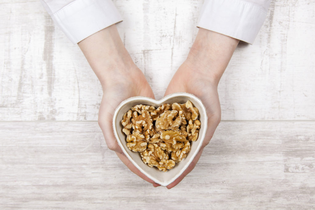 Walnuts in woman hands for a healthy heart