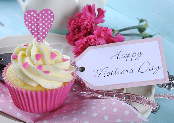 Happy Mothers Day aqua blue vintage retro shaby chic tray with pink cupcake close up with pink hearts and ribbon decoration and gift tag Pic: Istockphoto