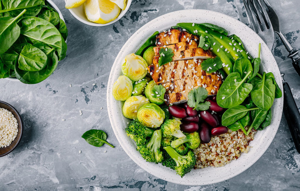 Healthy buddha bowl lunch with grilled chicken, quinoa, spinach, avocado, brussels sprouts, broccoli, red beans with sesame seeds Pic: Istockphoto