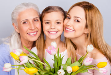 Mum, daughter and granddaughter with spring flowers for afternoon tea recipes and tips