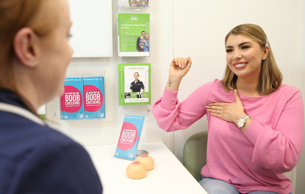 Love Island’s Olivia Buckland talks to a nurse during a breast check consultation at a Superdrug CoppaFeel! hub Pic: Isabel Infantes/PA Wire