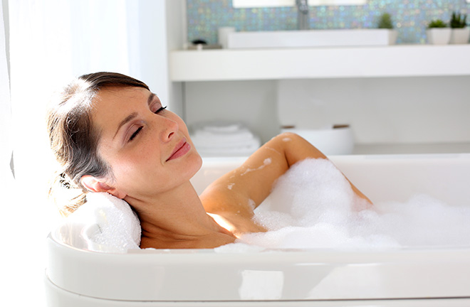 Beautiful woman relaxing in bathtub Pic: Istockphoto