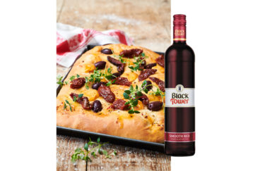 Focaccia bread and a bottle of Black Tower Smooth Red wine