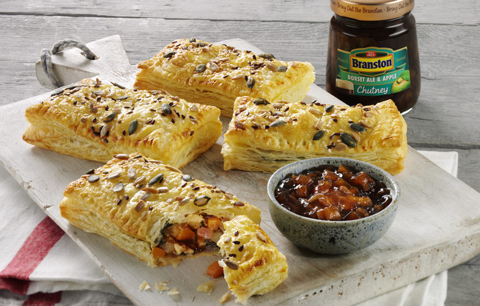 Cheese and pickle pastry puffs on a plate with dish and jar of Branston Dorset pickle