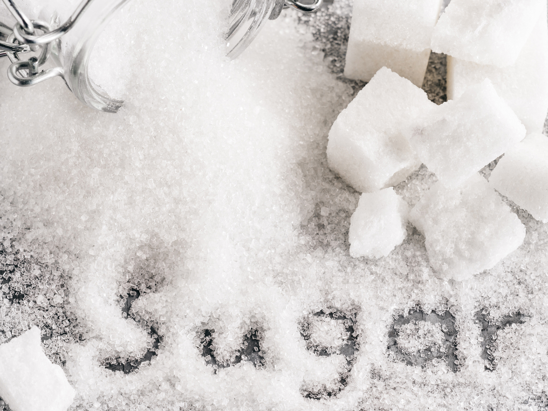 Close up view of word sugar of granulated sugar.