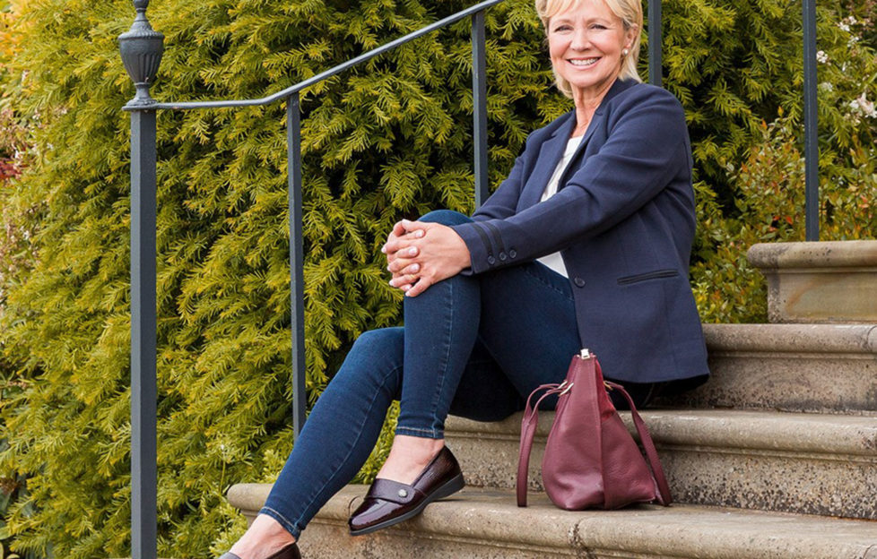 Woman sitting on step