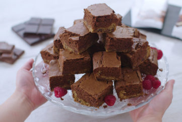 Pyramid of cut squares of two-layered chocolate brownie