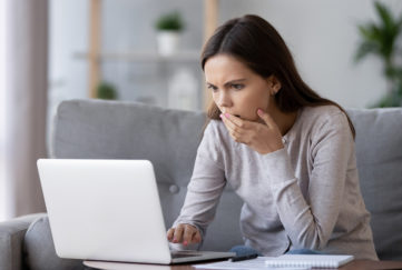 A lady worried after accessing bank details online Pic: Istockphoto