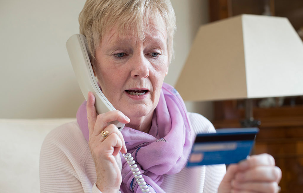 Lady giving credit card details over the phone Pic: Istockphoto
