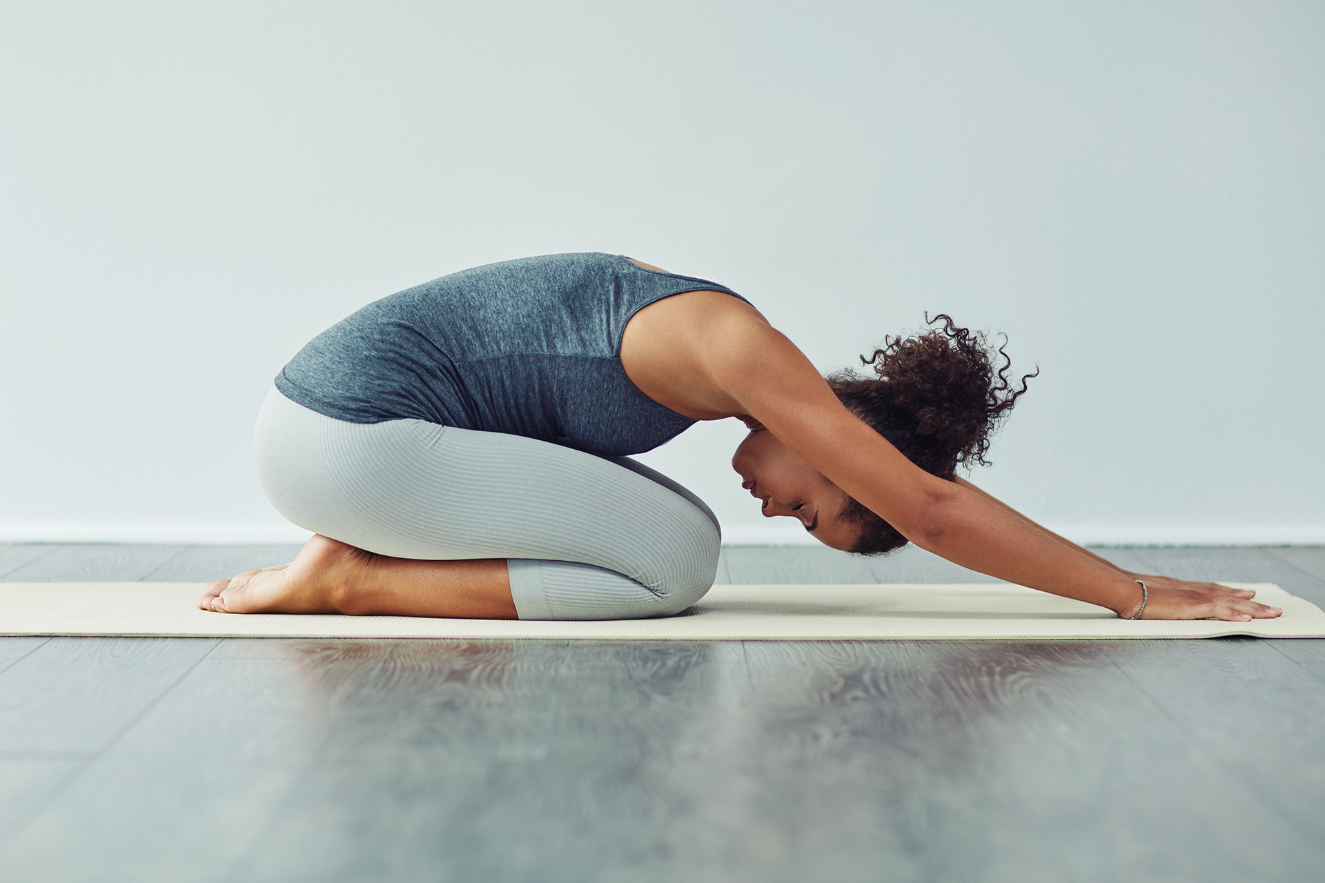 Woman in child's pose at yoga