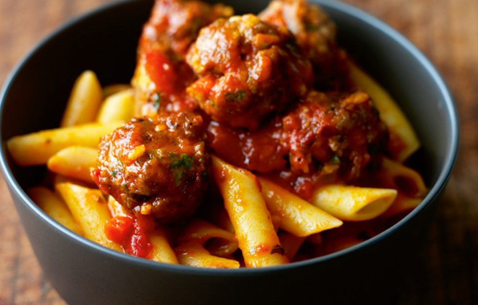 Bowl of meatballs, pasta and chunky cherry tomato sauce