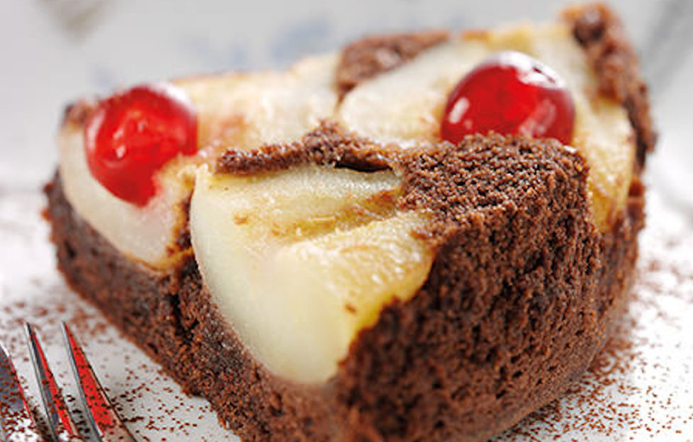 Chocolate and pear upside-down cake with glace cherries