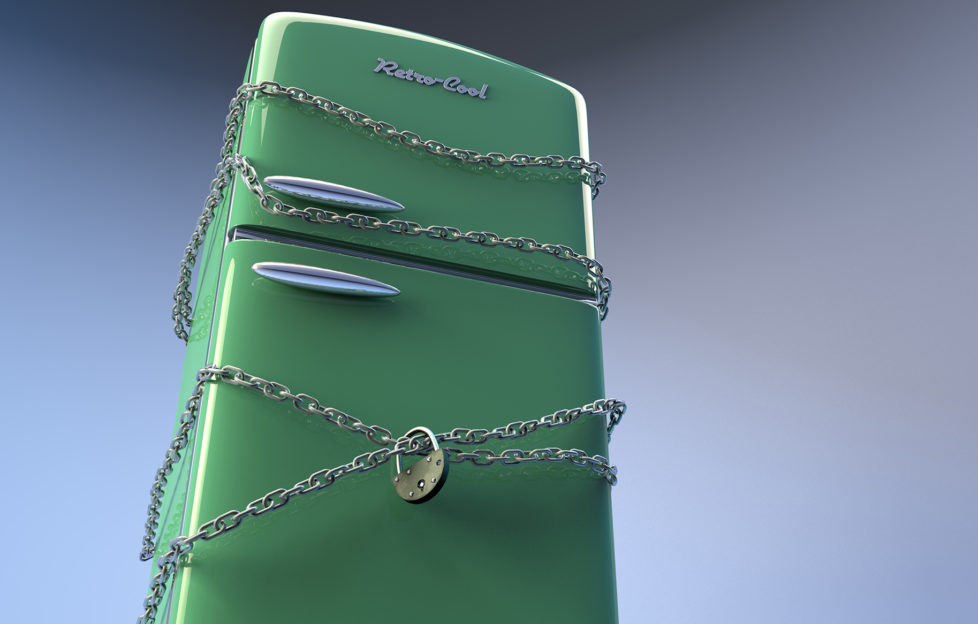 Chains and padlock on green fridge.