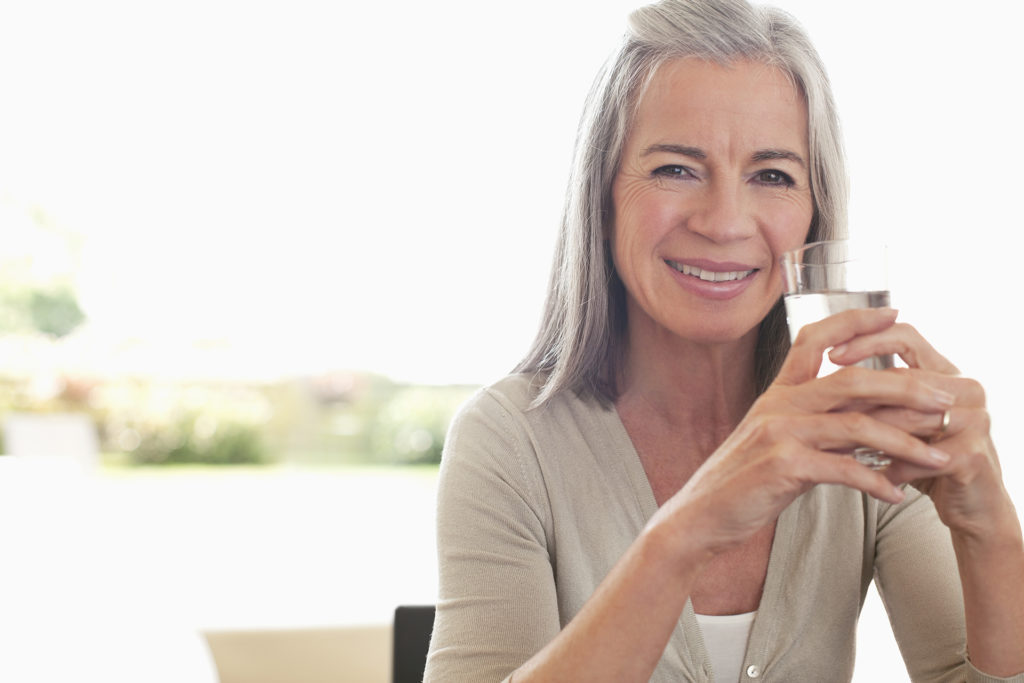 Woman drinking glass of water