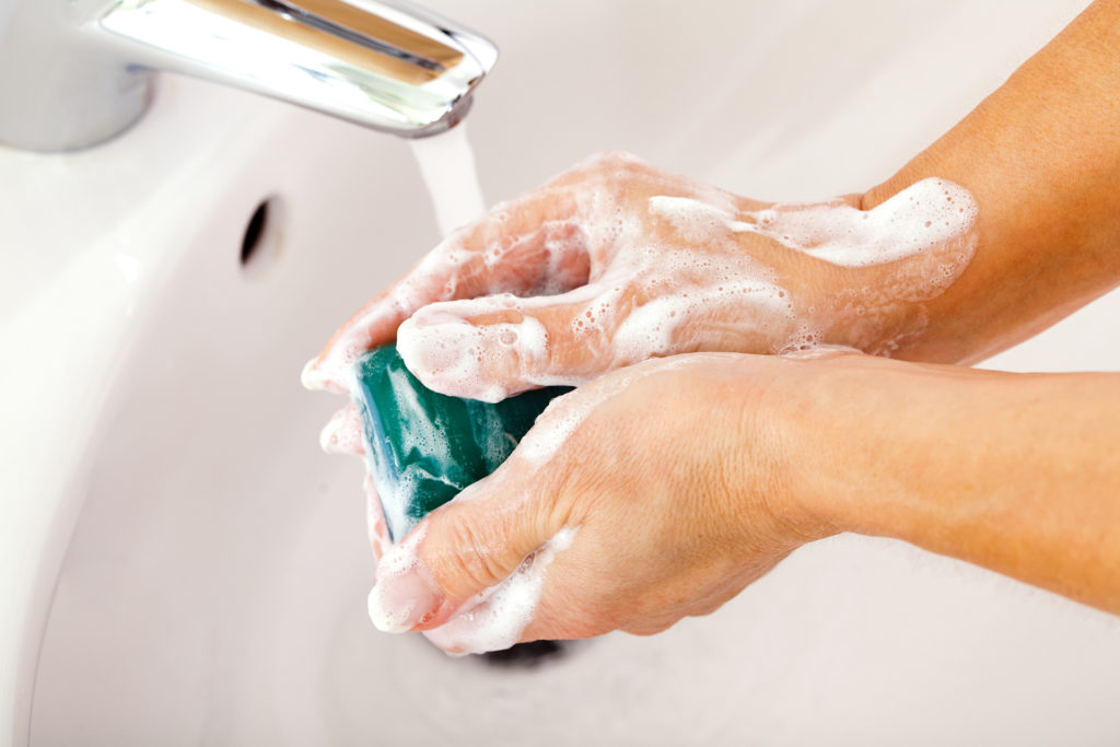Mature woman washing her hands