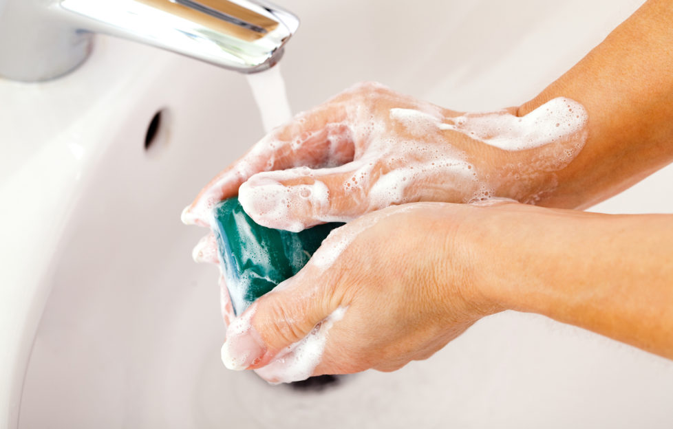 Mature woman washing her hands