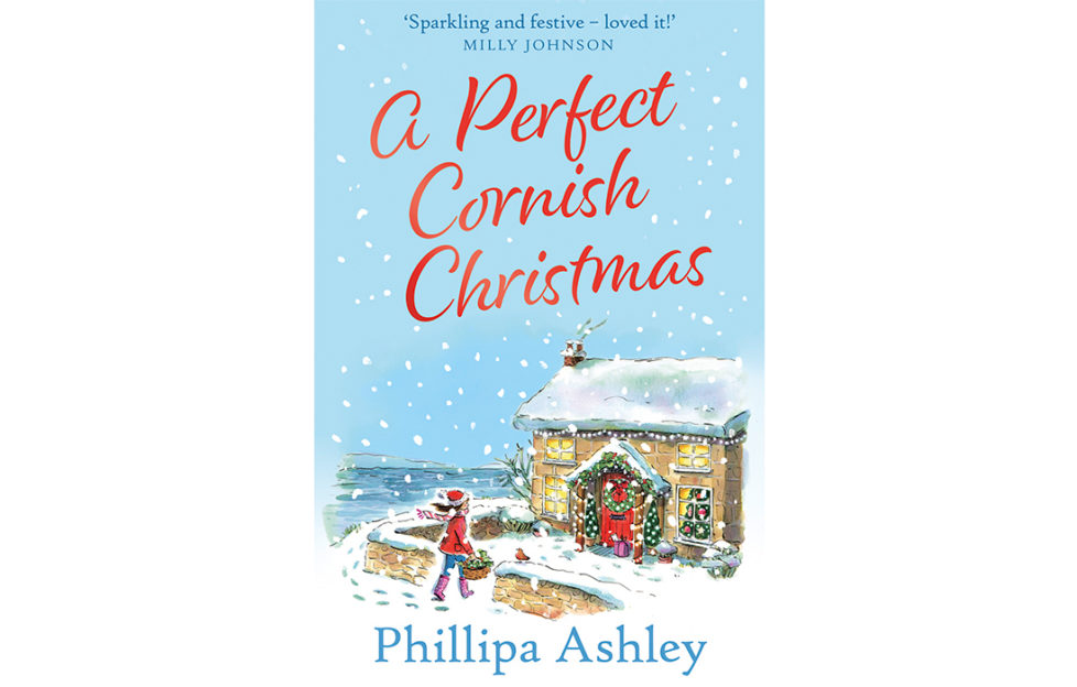 Cover of A Perfect Cornish Christmas, illustration of snowy scene, woman entering gate of stone house, Sea Holly Manor decorated for Christmas
