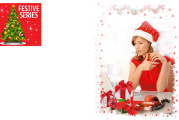 Woman in red dress and Santa hat, at desk with red phone and several wrapped gifts, staring glumly at computer screen