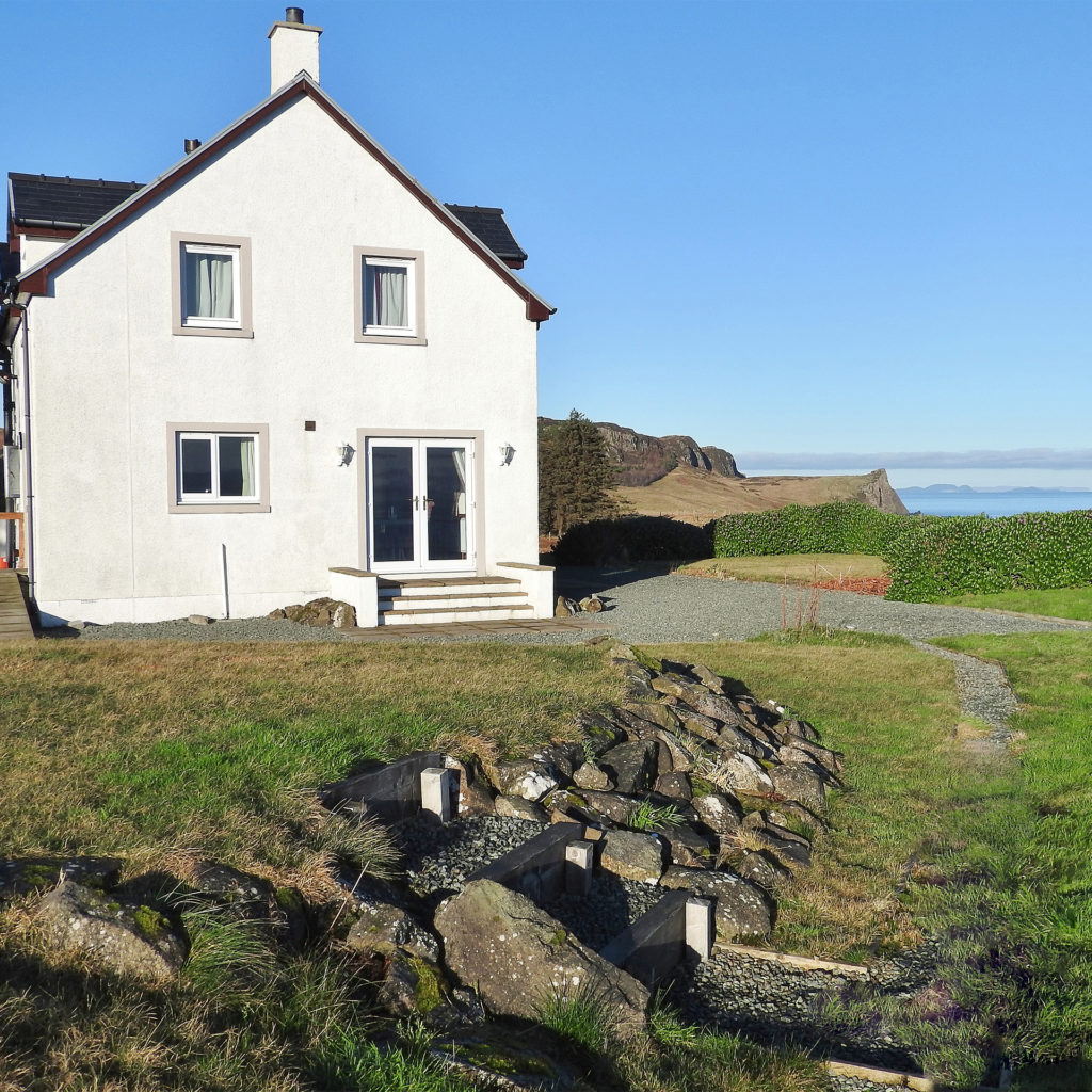 White painted cottage with double glazed windows, views out to sea
