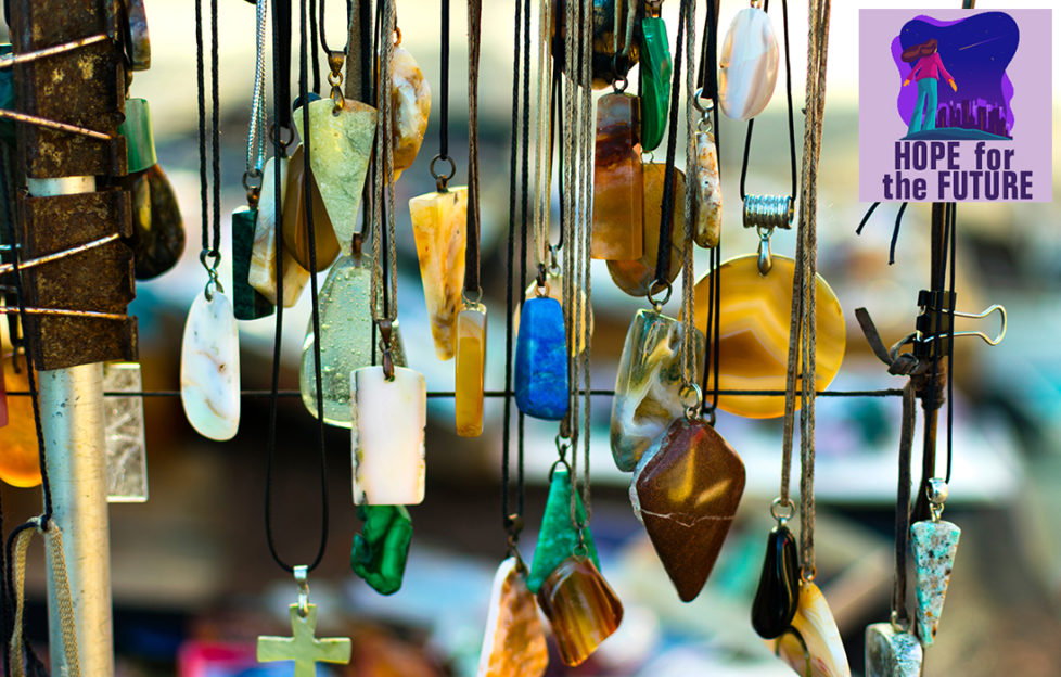 Semi precious stone pendants hanging on a craft stall