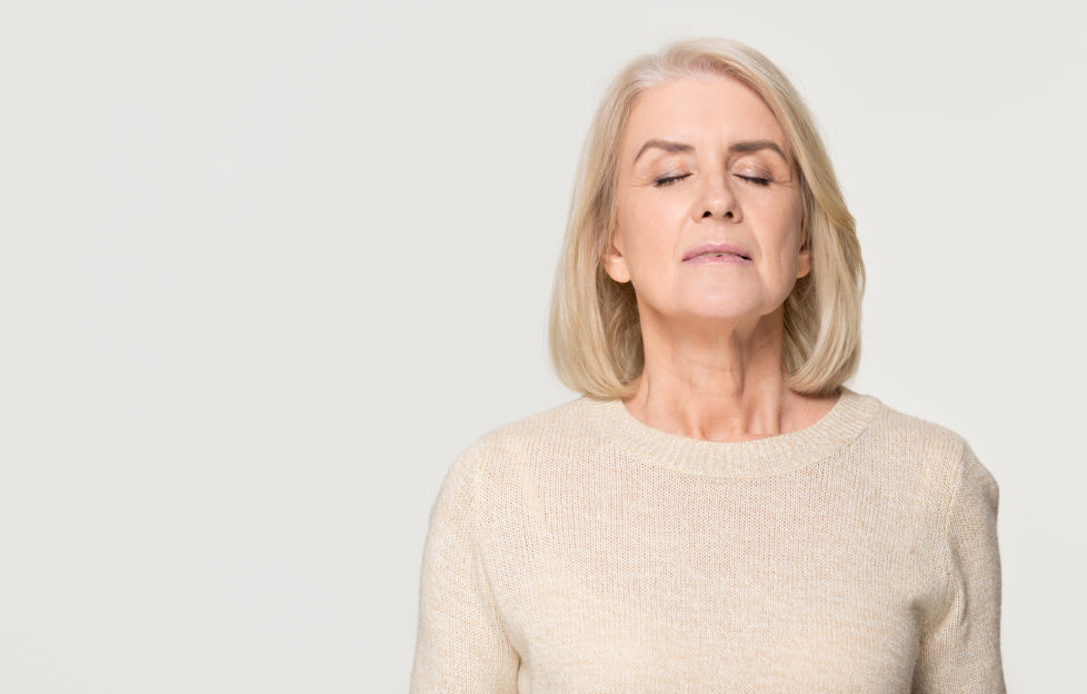 Woman taking deep calm breath