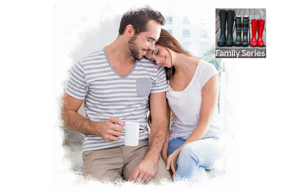 Young woman lays head on young man's shoulder, sitting with mugs of tea, talking about their dream