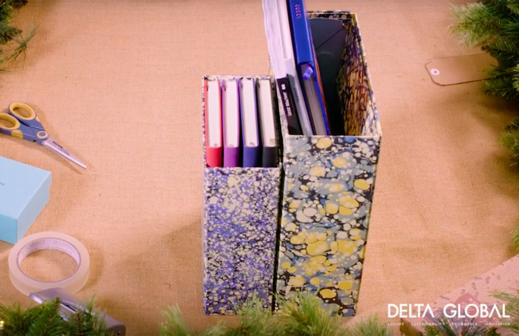 Cardboard boxes covered in stylish marbled paper to create file holders for home office, re-purposing