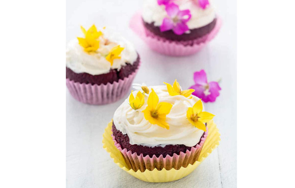Easter baking cupcakes with edible flowers