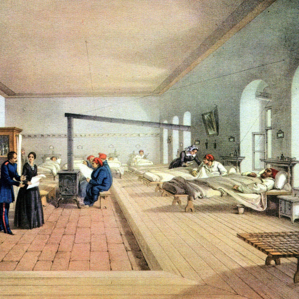 Coloured etching of Florence Nightingale in clean, bright, spacious hospital ward with stove, open windows, well spaced beds and well stocked medicine cabinets.