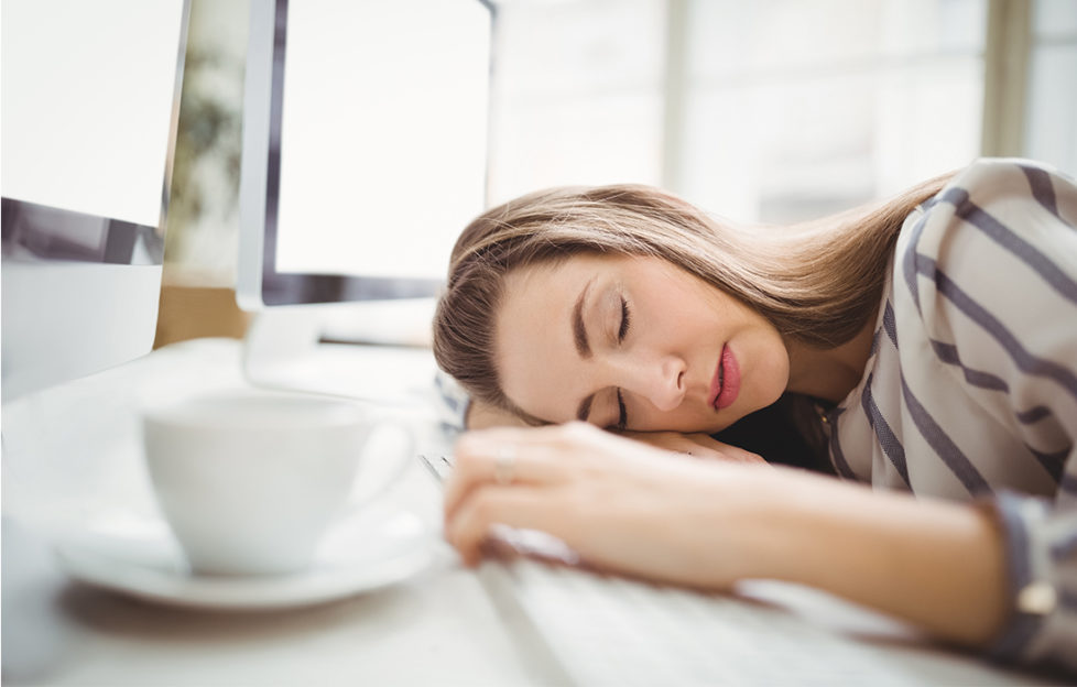 Woman has fallen asleep at her desk