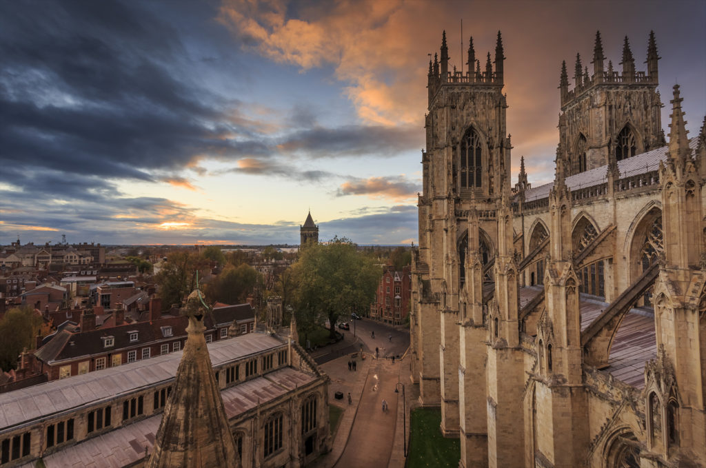 York Minster in the City of York England looking over the streets from above at sunset.