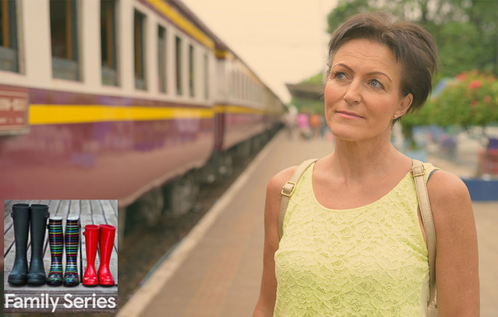 Empty nest. Woman in her 50s looking sad as train leaves